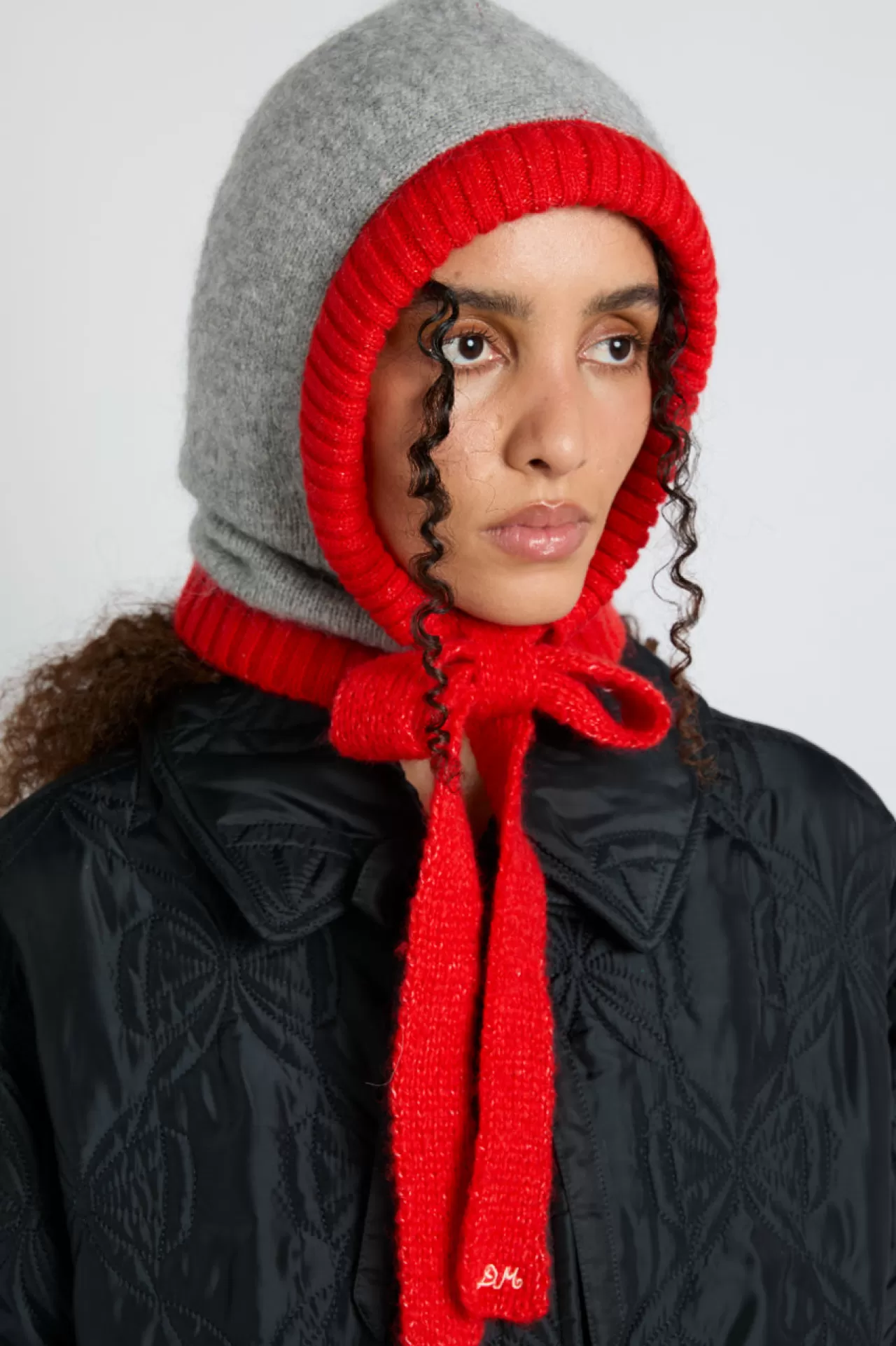Shop Damson Madder hood in marl with red tie in premium yarn grey